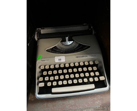 A Remington Envoy portable typewriter and a Silver Reed 500 portable typewriter 
