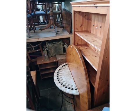 Assorted furniture comprising a pine bookcase, a pine table and chairs, a composition top console table, a pine bedside cabin