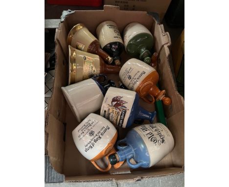 A box of ceramic whiskey flagons. 