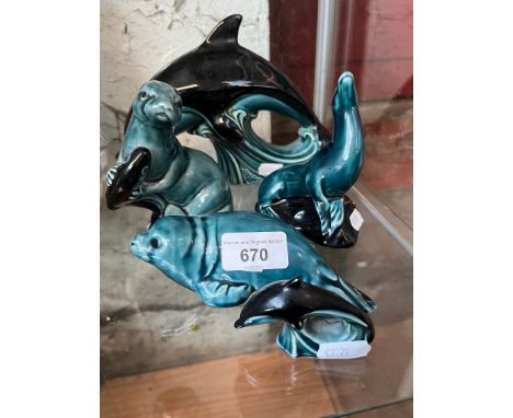 5 pieces of Poole pottery including 2 dolphins, a seal, a walrus and a beaver 