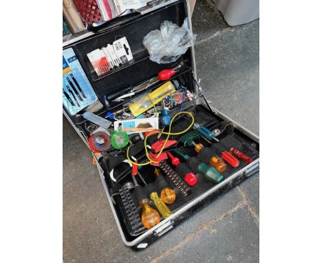 A briefcase style / tool case with tools. 