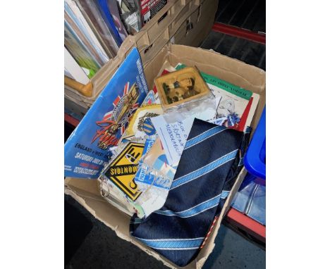 A box of various sporting memorabilia 