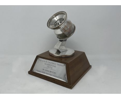 Set on a wooden base with a plaque reading 'The G.K.N. Castings Trophy Silverstone 1970 M. Hailwood Formula 5000 26th. April 