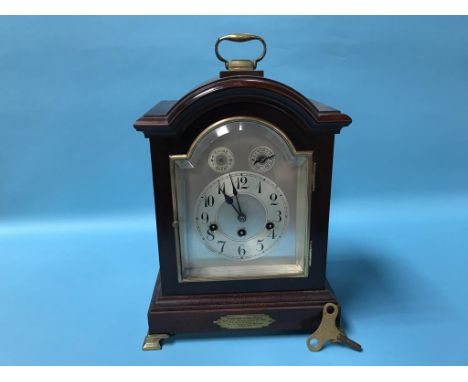 A mahogany eight day mantel clock
