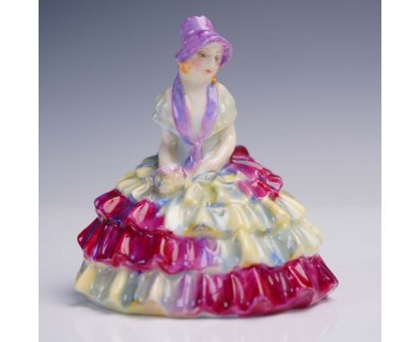 This elegant Royal Doulton porcelain figurine titled Chloe features a seated young lady in a multi-colored ruffled gown with 