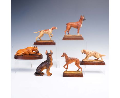 Collection of six hand-carved and painted dog figurines by Helmut Diller for Anri of Italy. Each figure is finely detailed an