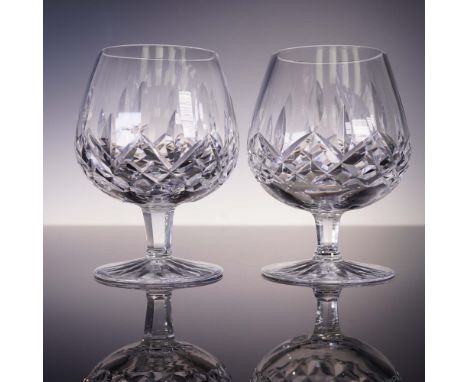 Pair of Waterford crystal brandy snifters with deep wedge cuts and broad bowls, ideal for enhancing aroma. Acid-etched Waterf
