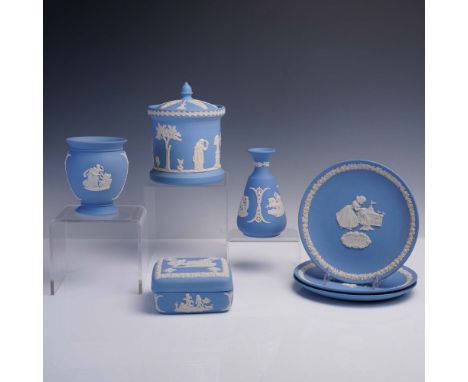 Delight in this enchanting 7 piece collection of Wedgwood Jasperware in classic blue with white relief, featuring two elegant
