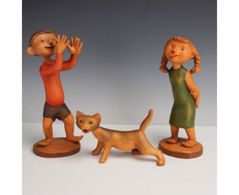 Italy: Anri, mid-to-late 20th century. A distinct trio of hand-carved and hand-painted wooden figurines by Anri, featuring a 