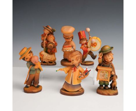 Italy: Anri, mid-to-late 20th century. A heartwarming collection of six hand-carved and hand-painted wooden figurines created