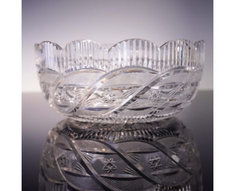 From Waterford's Prestige Collection, the Apprentice Bowl features a scalloped rim, swirl-cut pattern, and vertical fluting t