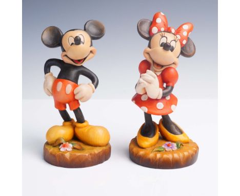 Pair of limited edition hand-carved wooden figurines by Anri of Italy, depicting Mickey Mouse and Minnie Mouse in classic att