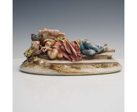 A serene and character-rich porcelain figurine by Antonio Borsato, titled Sleeping Man, depicting a weary figure stretched ac