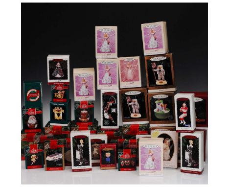Collection of 40 Hallmark Keepsake Ornaments, each in its original box. This assortment includes pieces from popular themed s