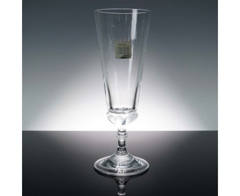 Refined clear crystal trumpet vase by Lalique Paris, showcasing a flared form with a tapered stem and broad circular base. Re