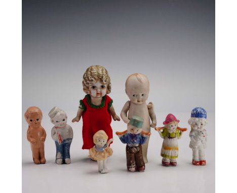 Collection of eight vintage bisque Frozen Charlotte dolls, each showcasing the timeless charm of early 20th-century Japanese 