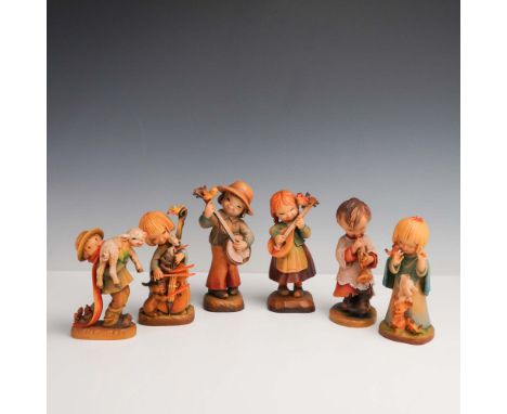 Italy: Anri, mid-to-late 20th century. A joyful 6-piece collection of hand-carved and hand-painted wooden figurines by J. Fer