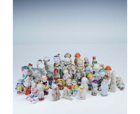 A vibrant and whimsical collection of fifty painted bisque dolls, most marked Japan, showcasing a delightful array of hand-pa