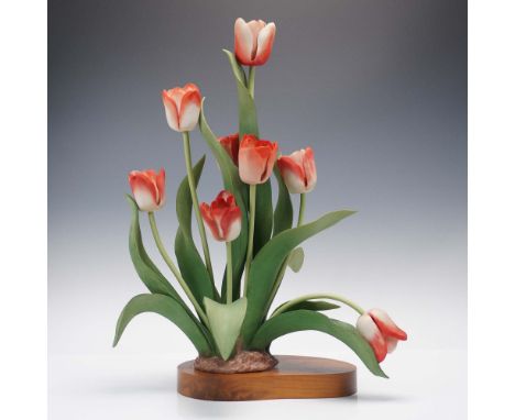 Exquisite limited edition porcelain sculpture featuring a vibrant spray of red and white tulips with graceful green leaves ri