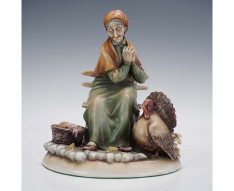 A finely crafted porcelain figurine by Italian artist Antonio Borsato, depicting an elderly woman seated on a stone bench bes