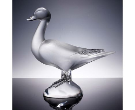 Crafted in exquisite clear and frosted crystal, this Lalique duck figurine embodies the brand's enduring artistry and devotio