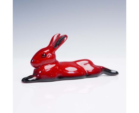 Royal Doulton flambe porcelain figurine depicting a reclining hare with its forelegs extended forward and hind legs stretched
