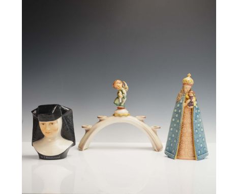 This 3-piece Hummel collection pays tribute to Sister Maria Innocentia Hummel, featuring a porcelain bust, a commemorative cr