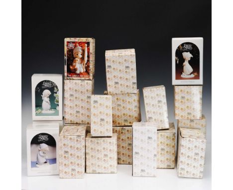 This charming 19-piece collection features porcelain figurines from the beloved Precious Moments line, each capturing tender 