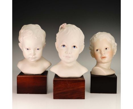 A charming trio of Cybis porcelain bust sculptures depicting the heads of children, each meticulously crafted in bisque porce