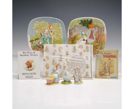 Collection of Beatrix Potter themed collectibles including figurines, plates, book, and ephemera. Features a 1990 edition har