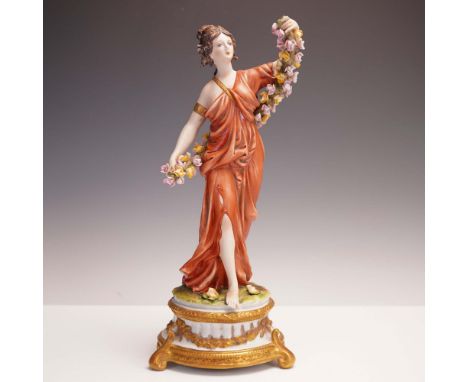 An elegant Italian Capodimonte-style porcelain figurine depicting a classical woman draped in a flowing rust-colored gown, gr