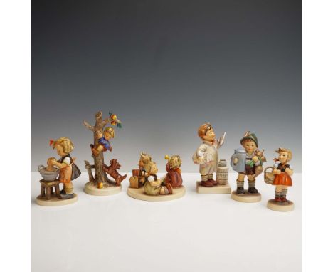 Set of six Goebel Hummel porcelain figurines featuring children in various heartwarming scenes including a girl washing a dol