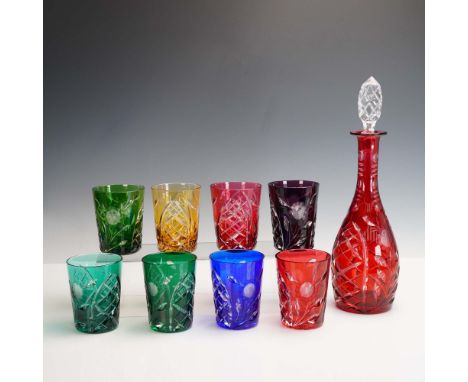 Elegant 10-piece cut to clear crystal barware set featuring a red decanter with faceted stopper and eight multi-colored tumbl