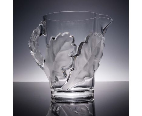 This impressive Lalique crystal pitcher features the iconic Chene (oak) pattern, adorned with deeply molded frosted oak leave