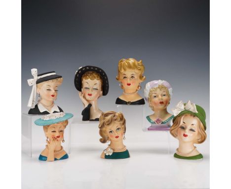 This charming 7-piece collection of vintage lady head vases was manufactured by Enesco in Japan during the mid-20th century, 
