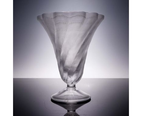 The Lucie vase by Lalique features an elegant flared form with gently scalloped edges and a cascading pattern of feathered ri