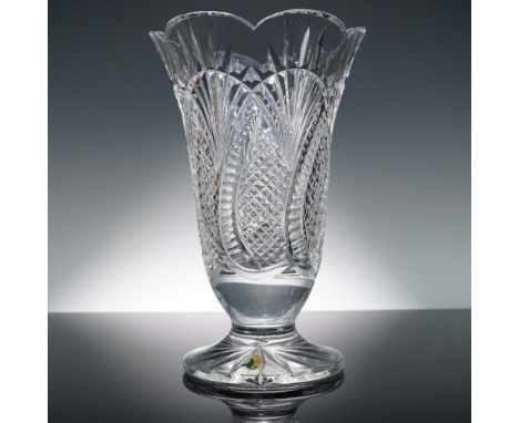 This Seahorse Vase by Waterford Crystal features intricate cross-hatch and vertical cuts, a scalloped rim, and a star-cut foo