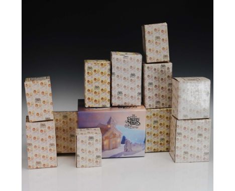 This 12-piece set from the Enesco Precious Moments Collection features charming hand-painted porcelain bisque figurines, each