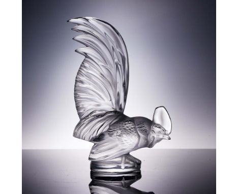 The Coq Nain rooster figurine by Lalique is a commanding example of Art Deco elegance, sculpted in clear and frosted crystal.