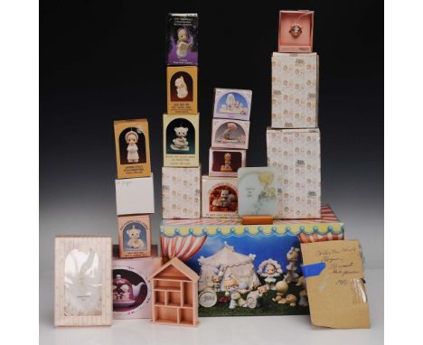 A 20-piece collection of Precious Moments items including porcelain figurines, hanging ornaments, a teapot-shaped waterball, 
