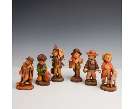 A delightful set of six hand-carved and hand-painted wooden figurines by Anri, Italy, designed by the renowned Spanish artist
