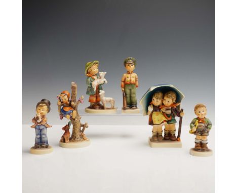 This 6pc Hummel Goebel figurine set captures a variety of tender and expressive childhood scenes rendered in vibrant hand pai