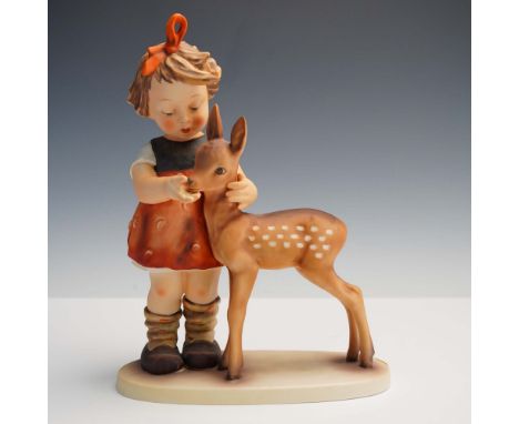 This charming Goebel Hummel porcelain figurine titled Friends (model 136) depicts a young girl gently cradling a fawn, showca
