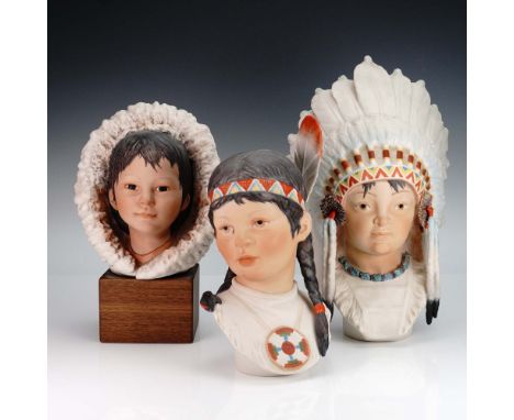 A captivating set of three Cybis porcelain busts portraying children of Indigenous and Inuit heritage. This lot includes: a y