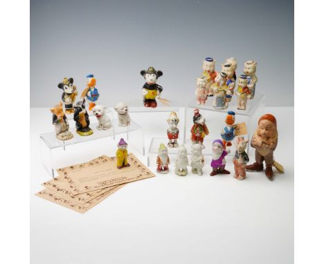 A rare and whimsical 24-piece collection of early bisque figurines depicting beloved Disney characters, most marked Japan. Th