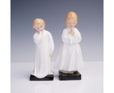 Pair of Royal Doulton bone china figurines featuring children in nightwear poses. The figurine titled "Bedtime", designed by 