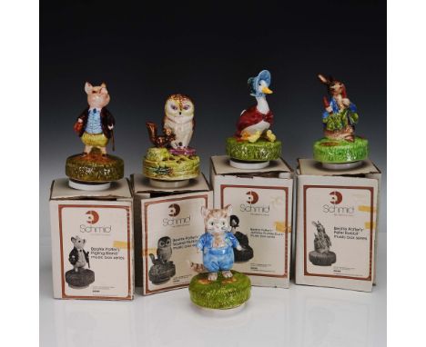 Charming collection of five ceramic music box figurines from Schmid's Beatrix Potter series, each featuring a beloved charact