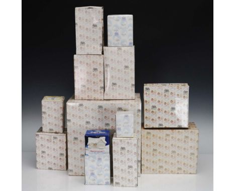 A charming 13-piece collection of Precious Moments porcelain figurines and accessories, featuring hand-painted designs that c