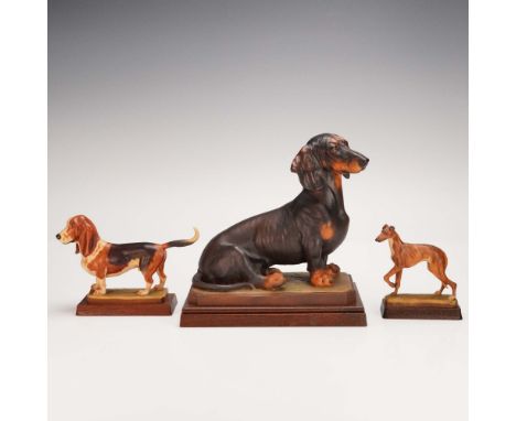 This delightful trio of hand-carved and hand-painted wooden dog figurines was crafted by Anri, the renowned Italian workshop 