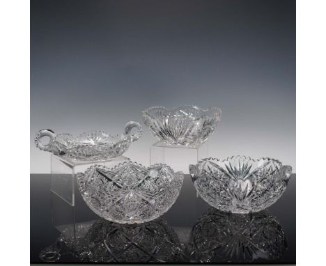 Gorgeous collection of four cut crystal bowls, each showcasing deeply cut geometric and floral patterns with exceptional clar
